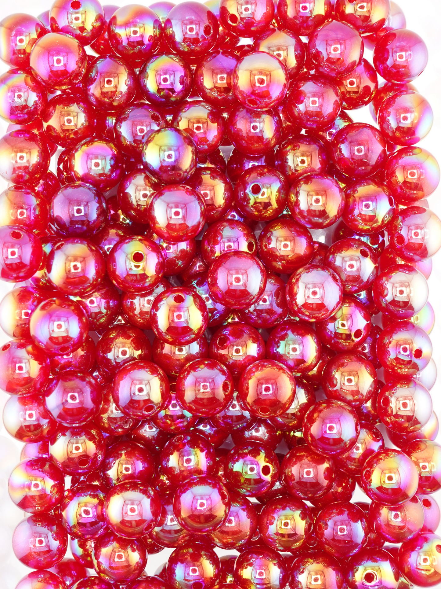 Collection of burgundy colored beads with an aurora borealis and galaxy shimmer