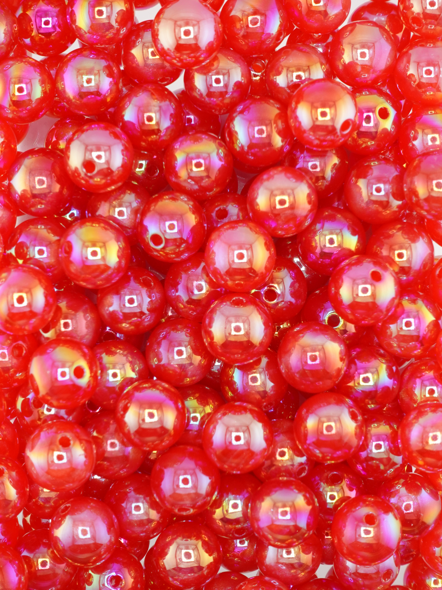Collection of red colored beads with an aurora borealis shimmer