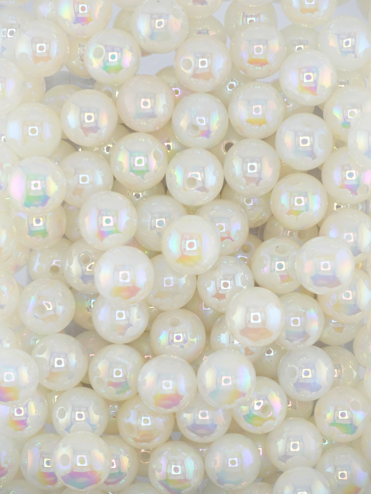 Collection of white colored beads with an aurora borealis shimmer
