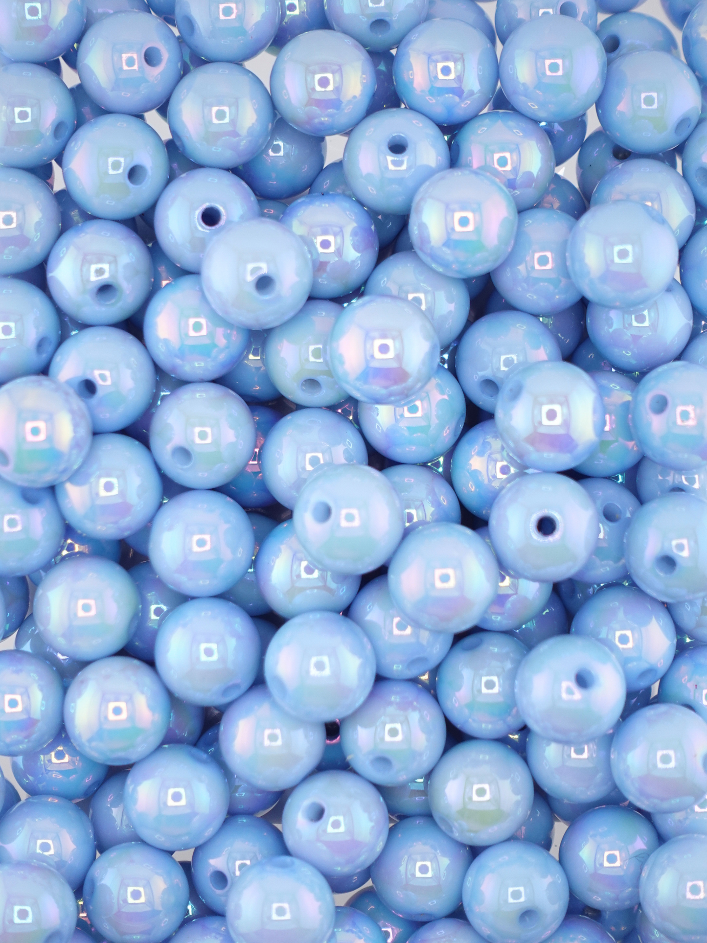 Collection of light blue colored beads with an aurora borealis finish