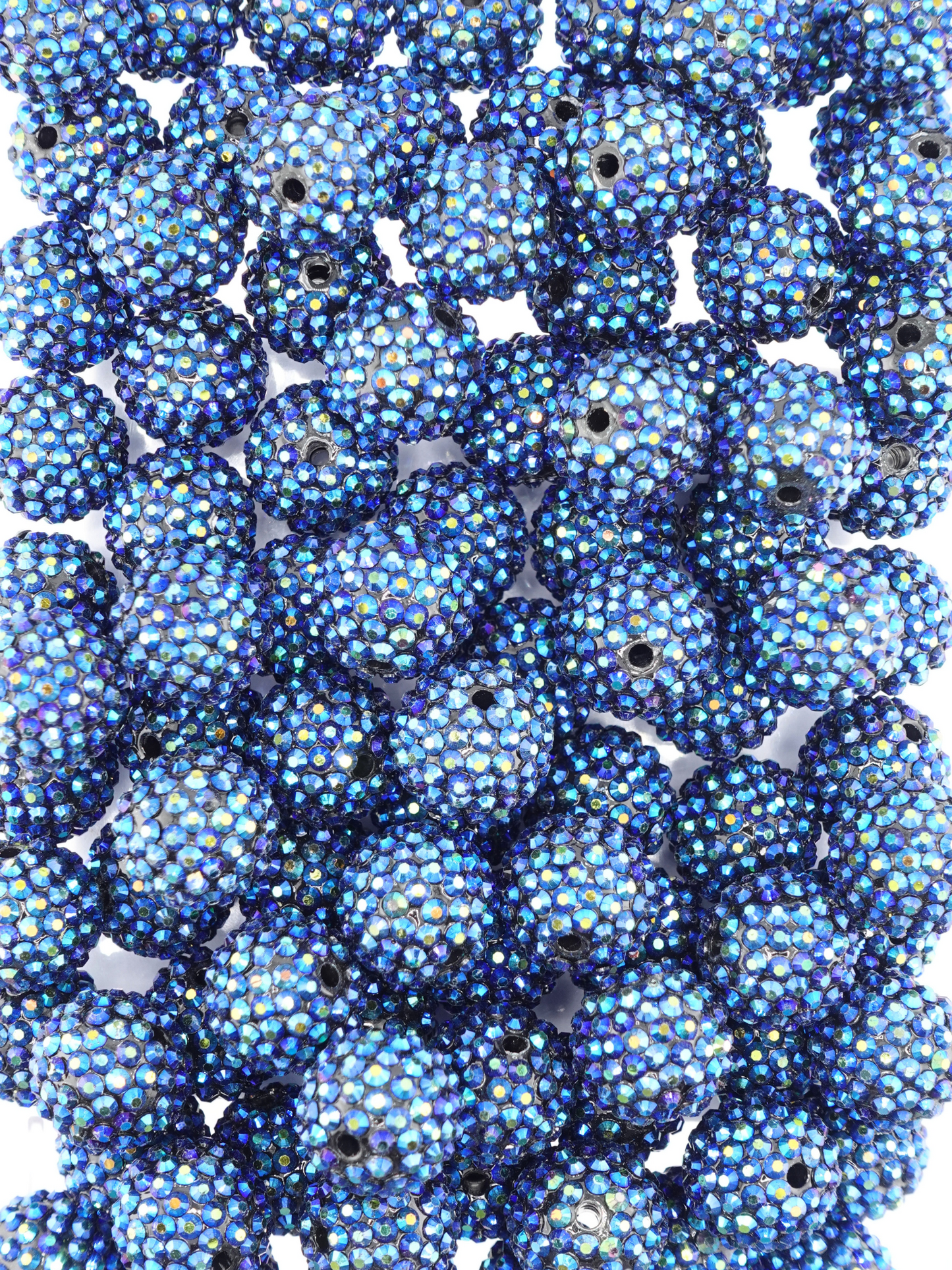 Collection of navy blue colored beads with shiny aurora borealis finish and rhinestone texture
