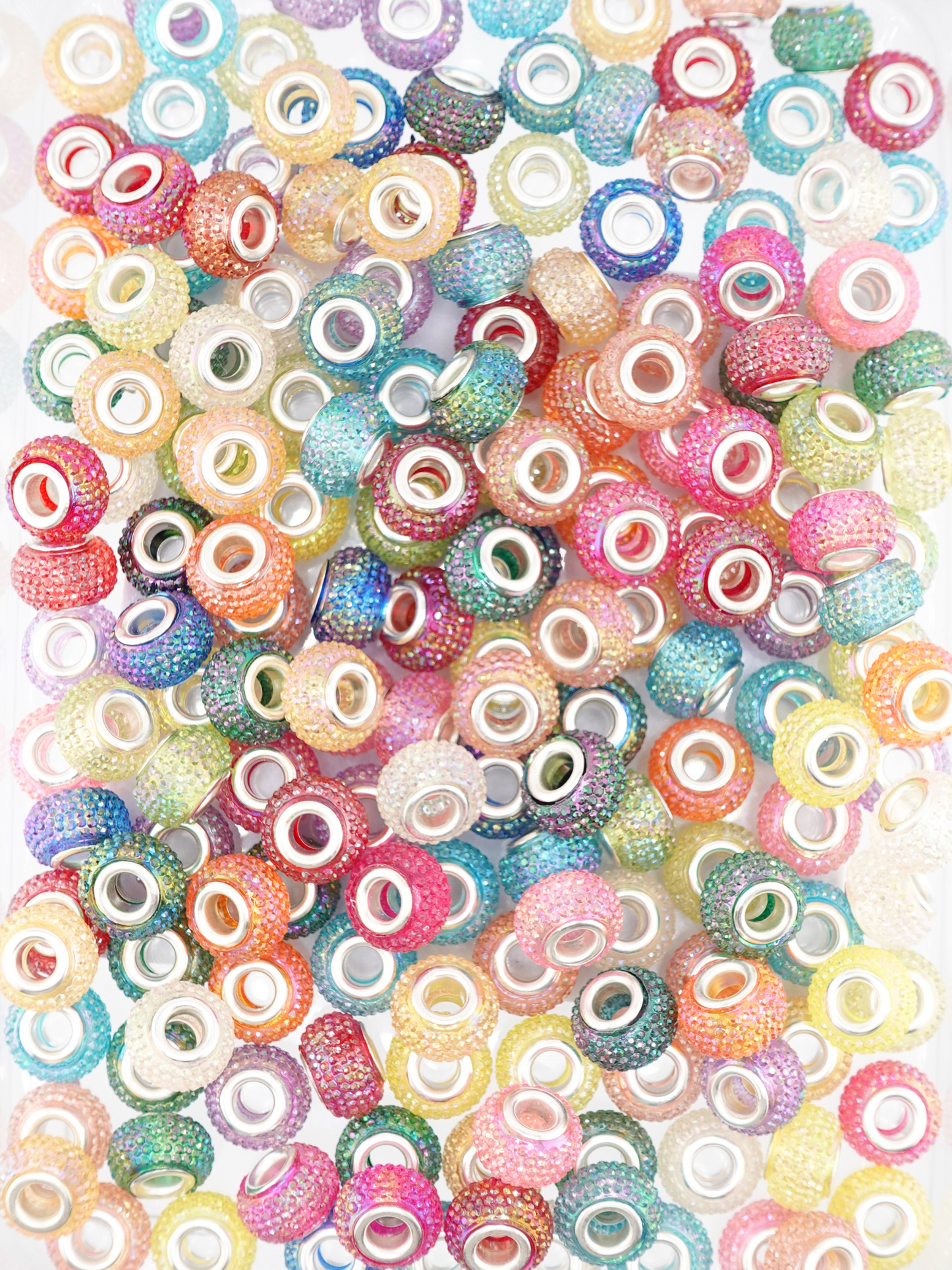 Collection of different colored spacers with a textured studded finish
