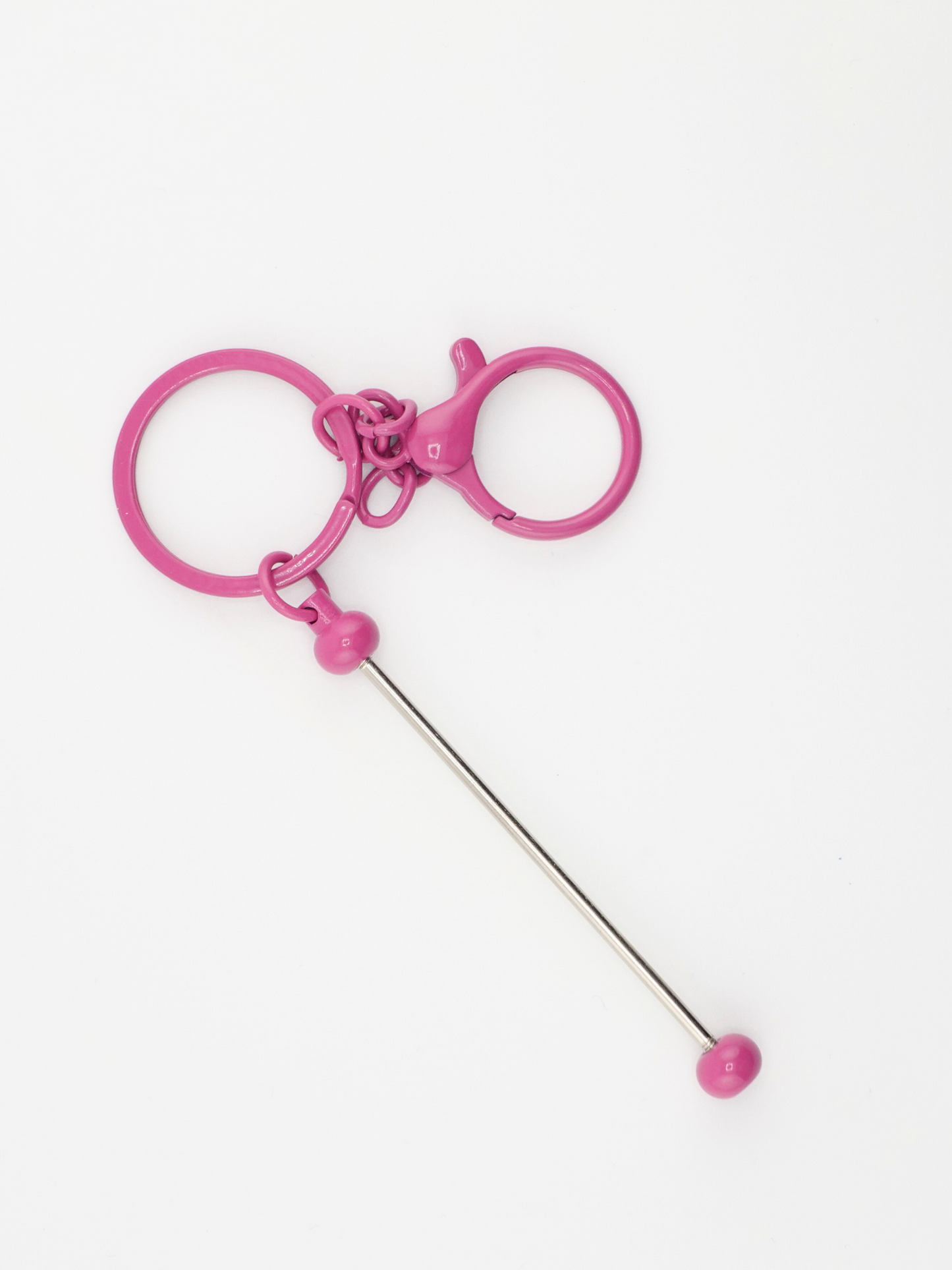 A single fuchsia colored beadable keychain