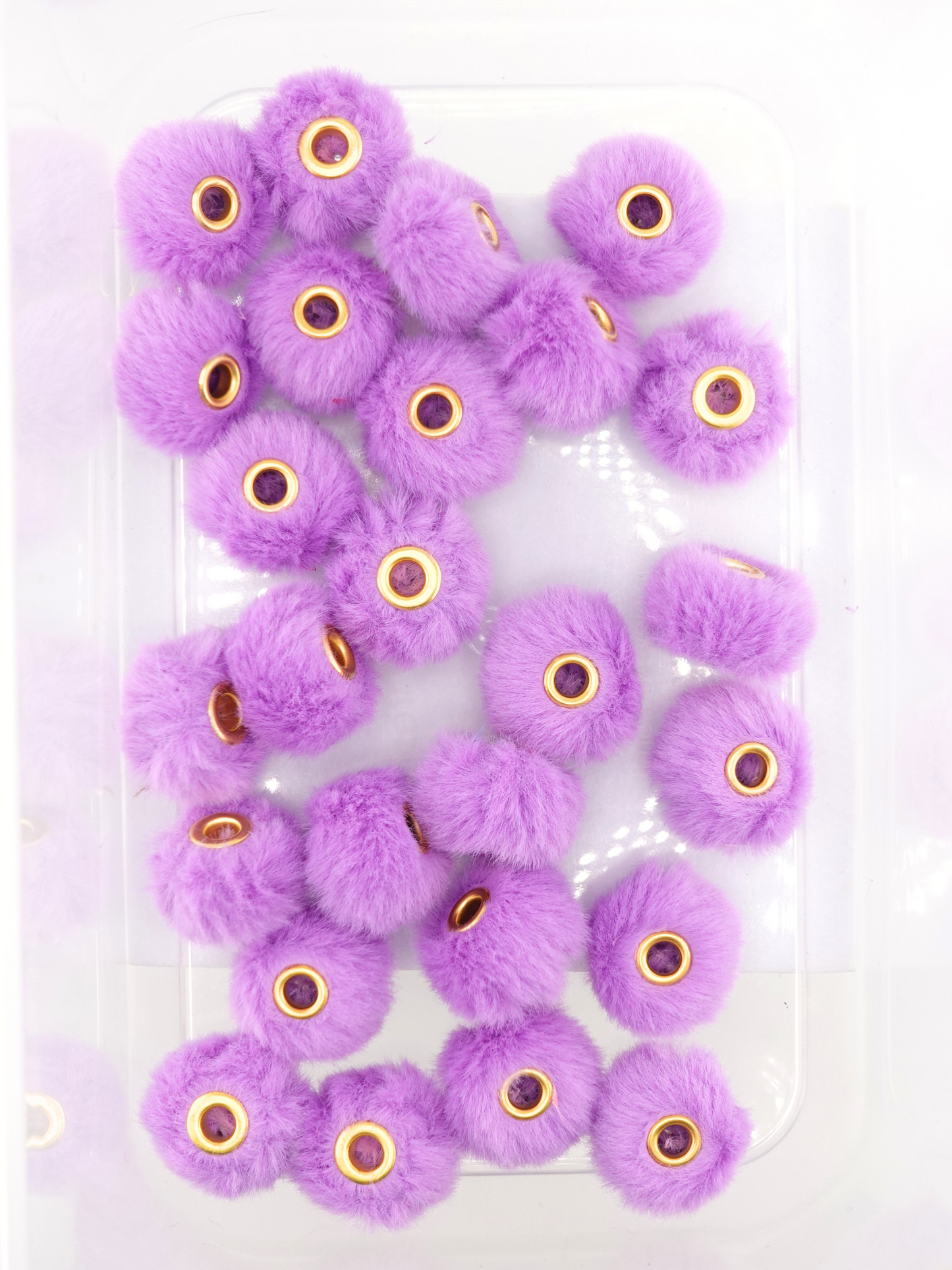 Collection of dark purple fuzzy pom pom spacers