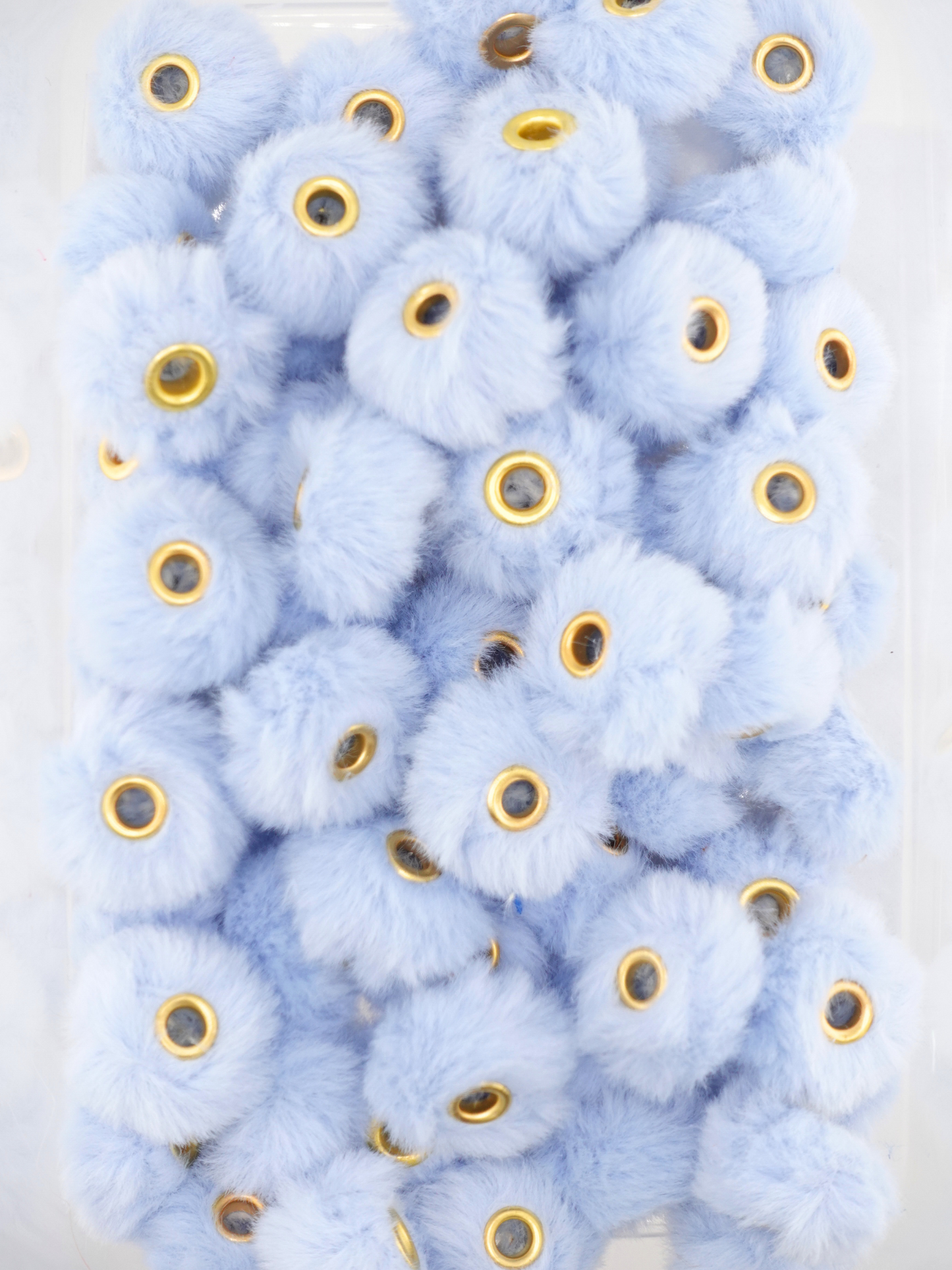 Collection of periwinkle fuzzy pom pom spacers