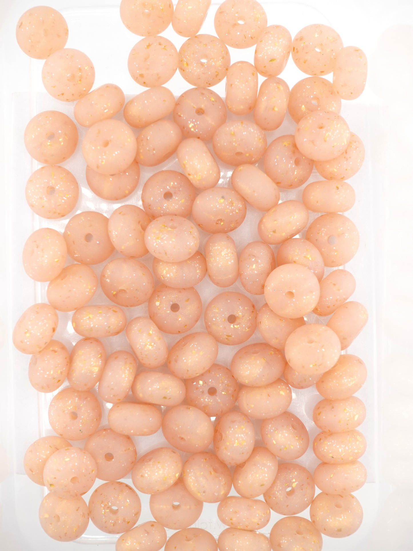 Collection of champagne colored silicone spacers with confetti design