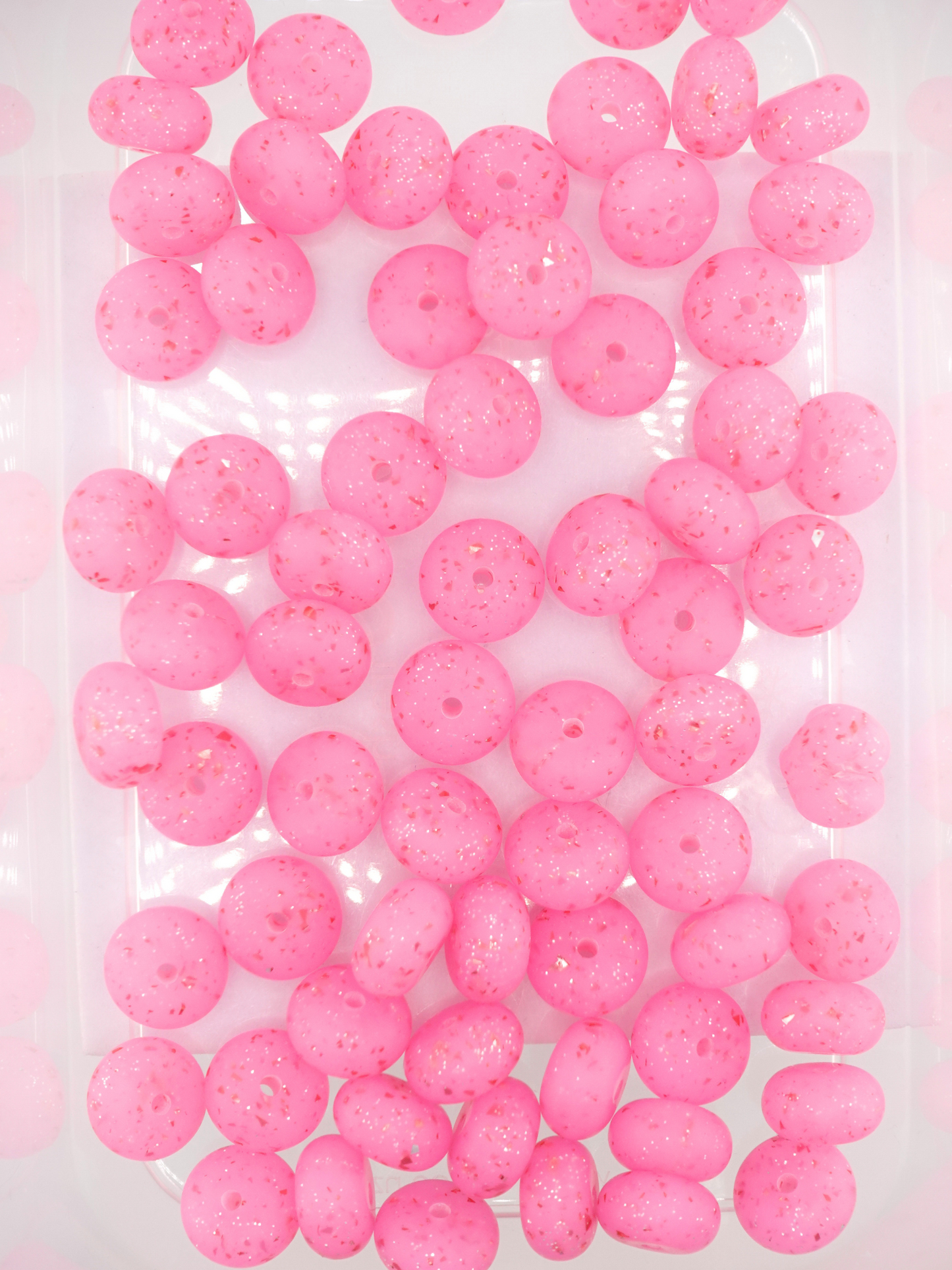 Collection of hot pink silicone spacers with confetti design