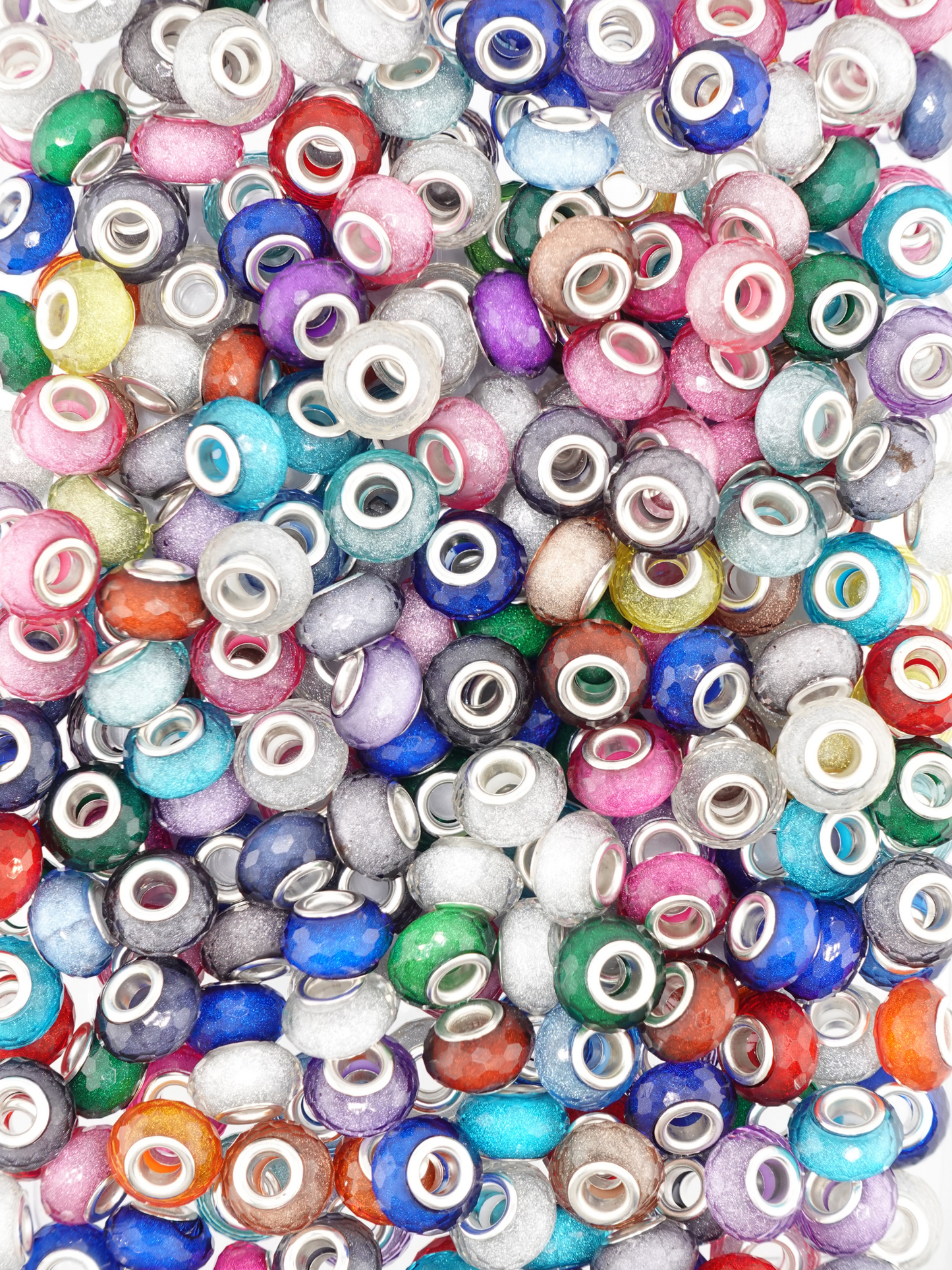 Collection of different colored spacers with a glitter finish