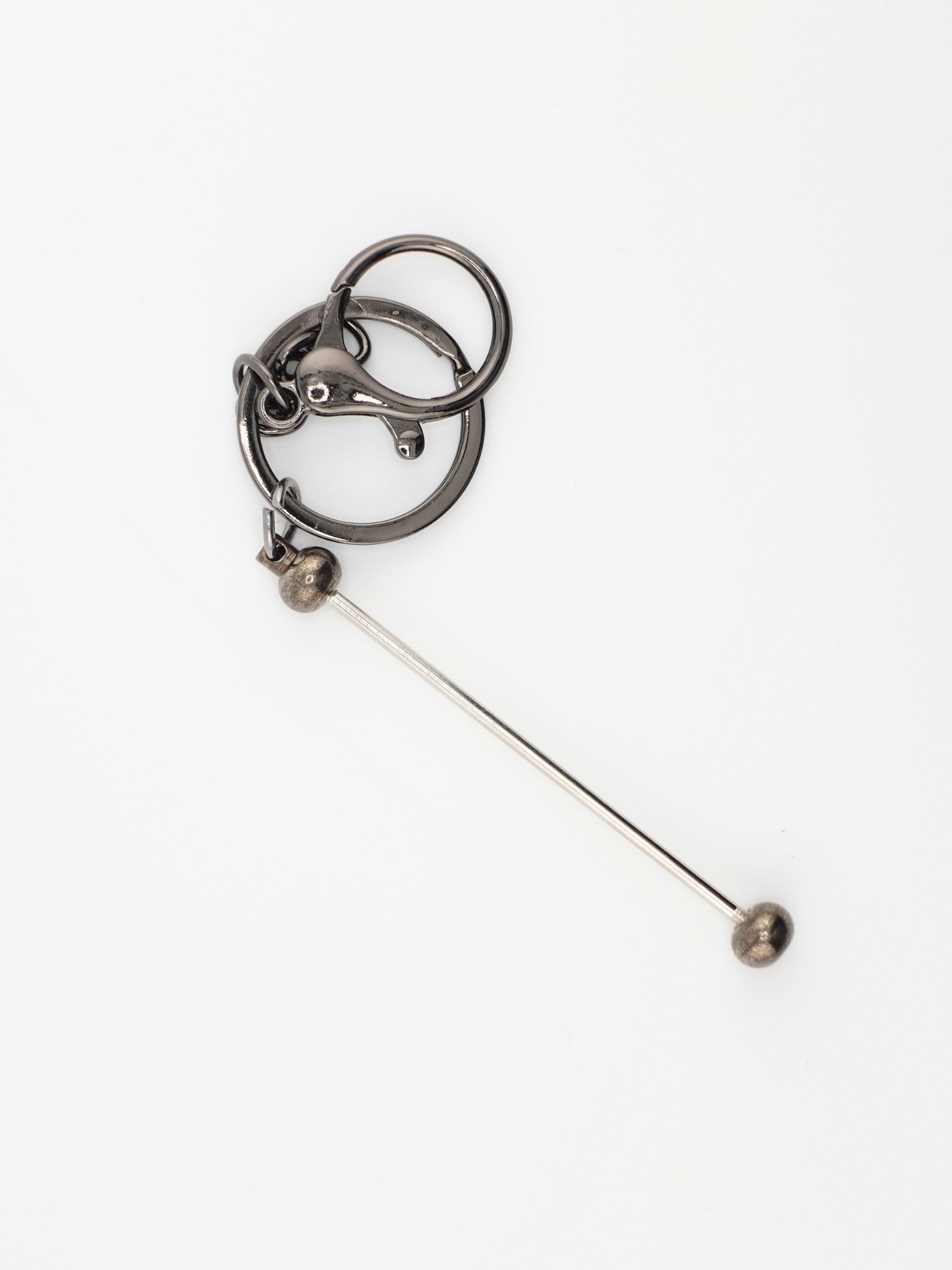 A single gunmetal colored beadable keychain