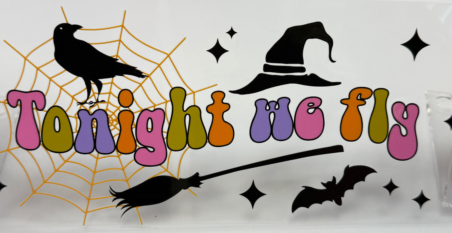 Halloween-themed with colorful text, black hat, crow, broomstick, and bat