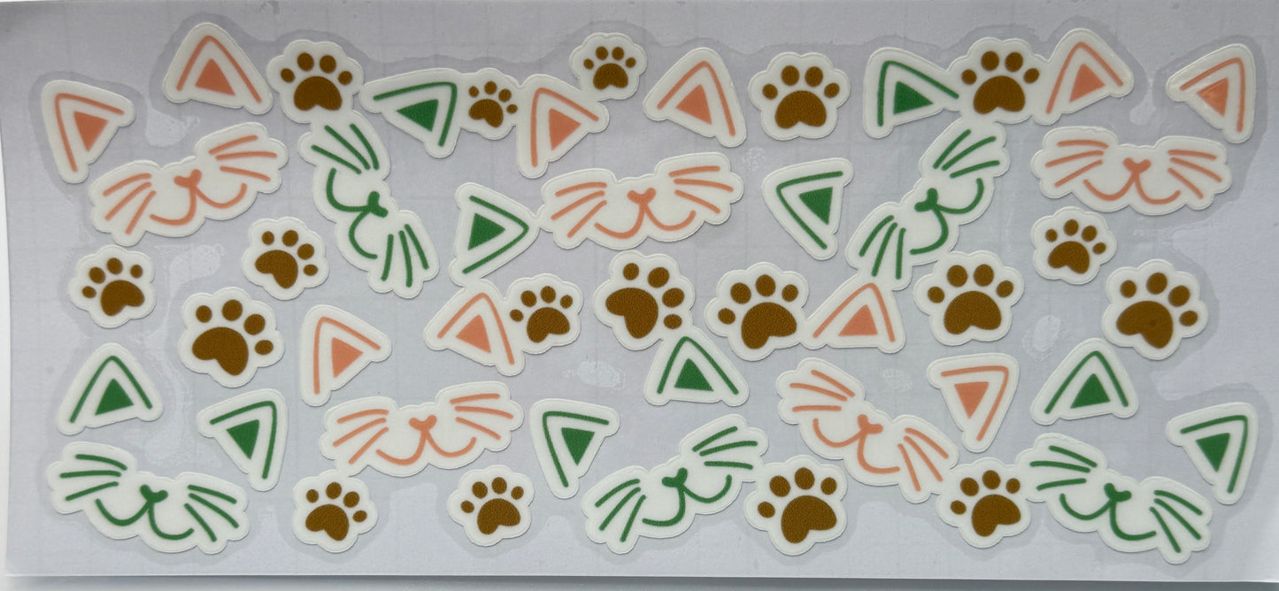 Set of animal-themed stickers with paw prints, triangles, and cat faces