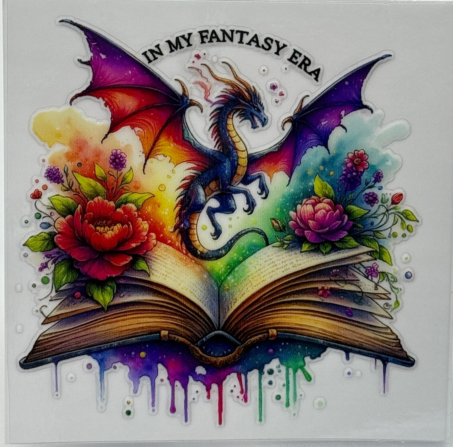 Colorful dragon illustration on an open book with flowers, text 'In My Fantasy Era'