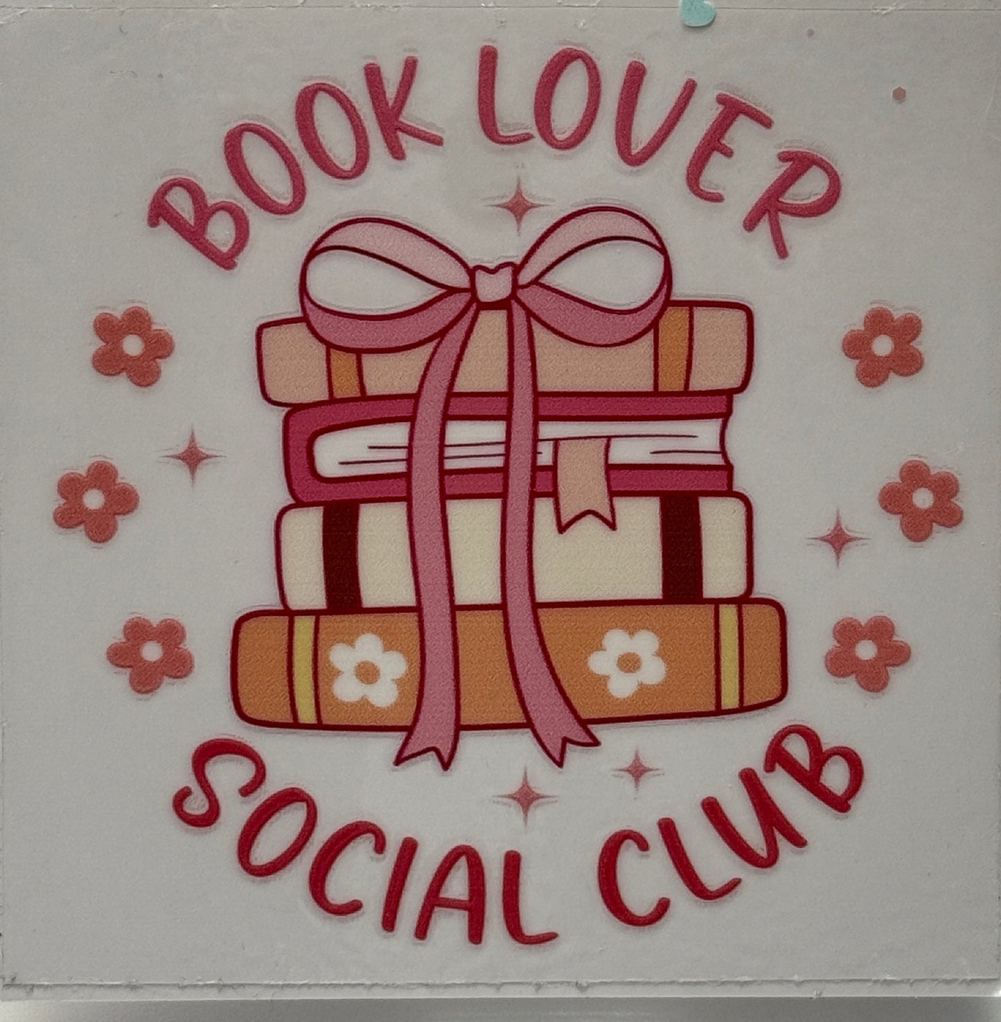 Sticker with books, a bow, and flowers with 'Book Lover Social Club' text