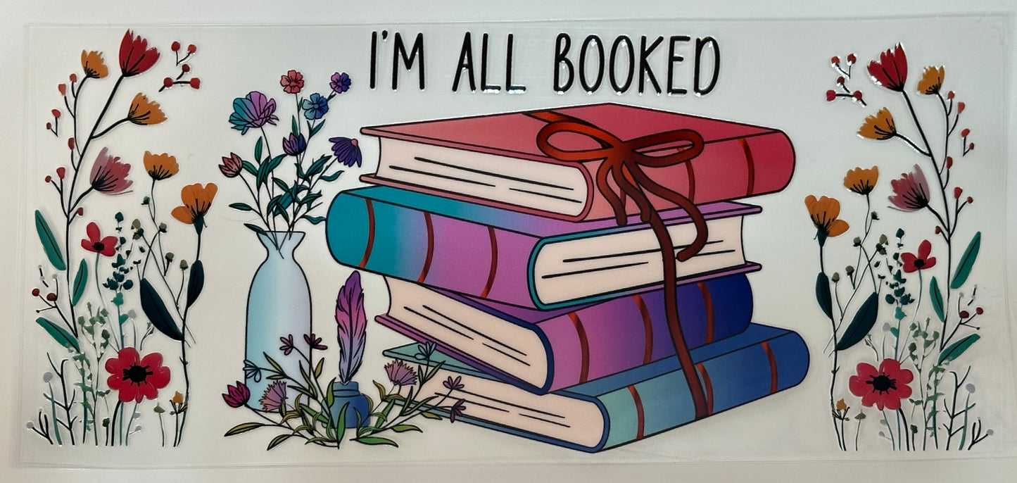 Decorative sign with books and flowers saying 'I'm All Booked'