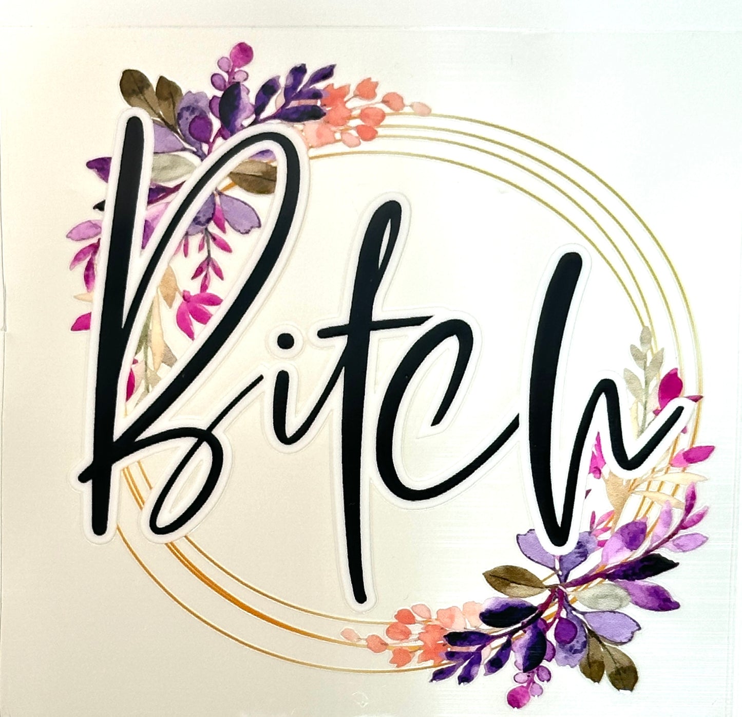 The word 'B!tch' surrounded by floral decorations
