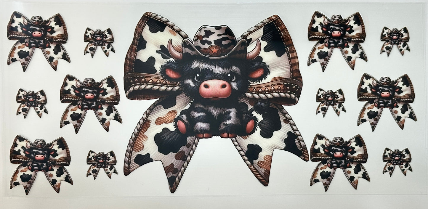 Decorative bow with a cow design and cowgirl hat