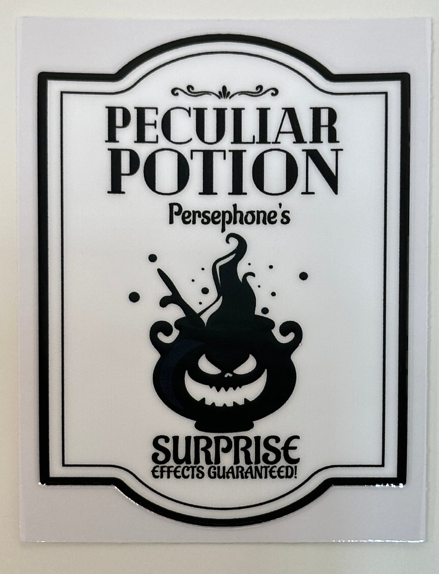 Sticker with 'Peculiar Potion' design featuring a potion bottle and text