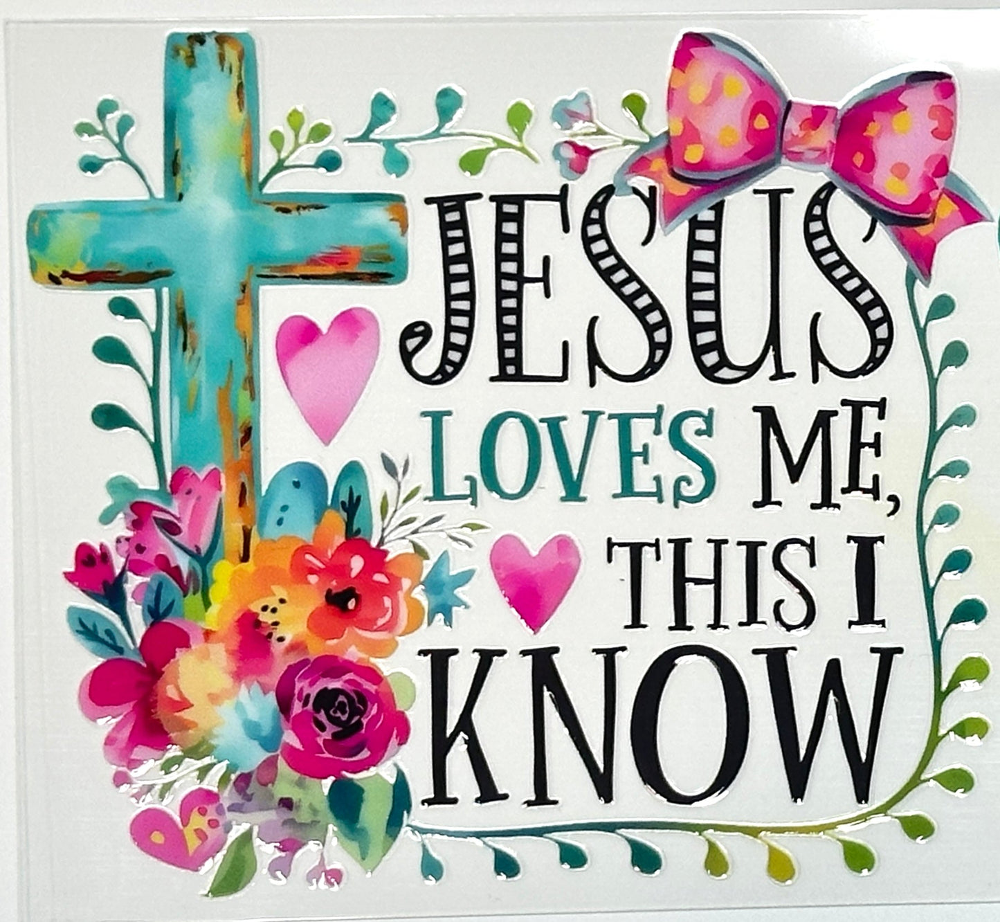Decorative sign with 'Jesus Loves Me, This I Know' text, cross, flowers, and hearts