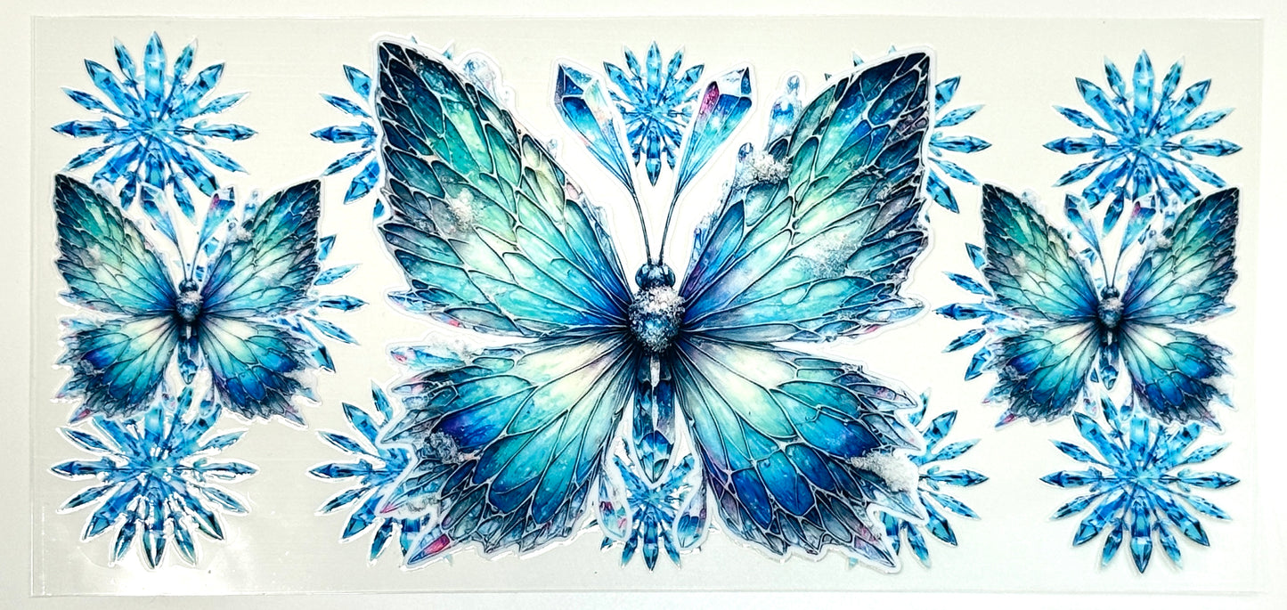 Three blue butterflies surrounded by snowflakes