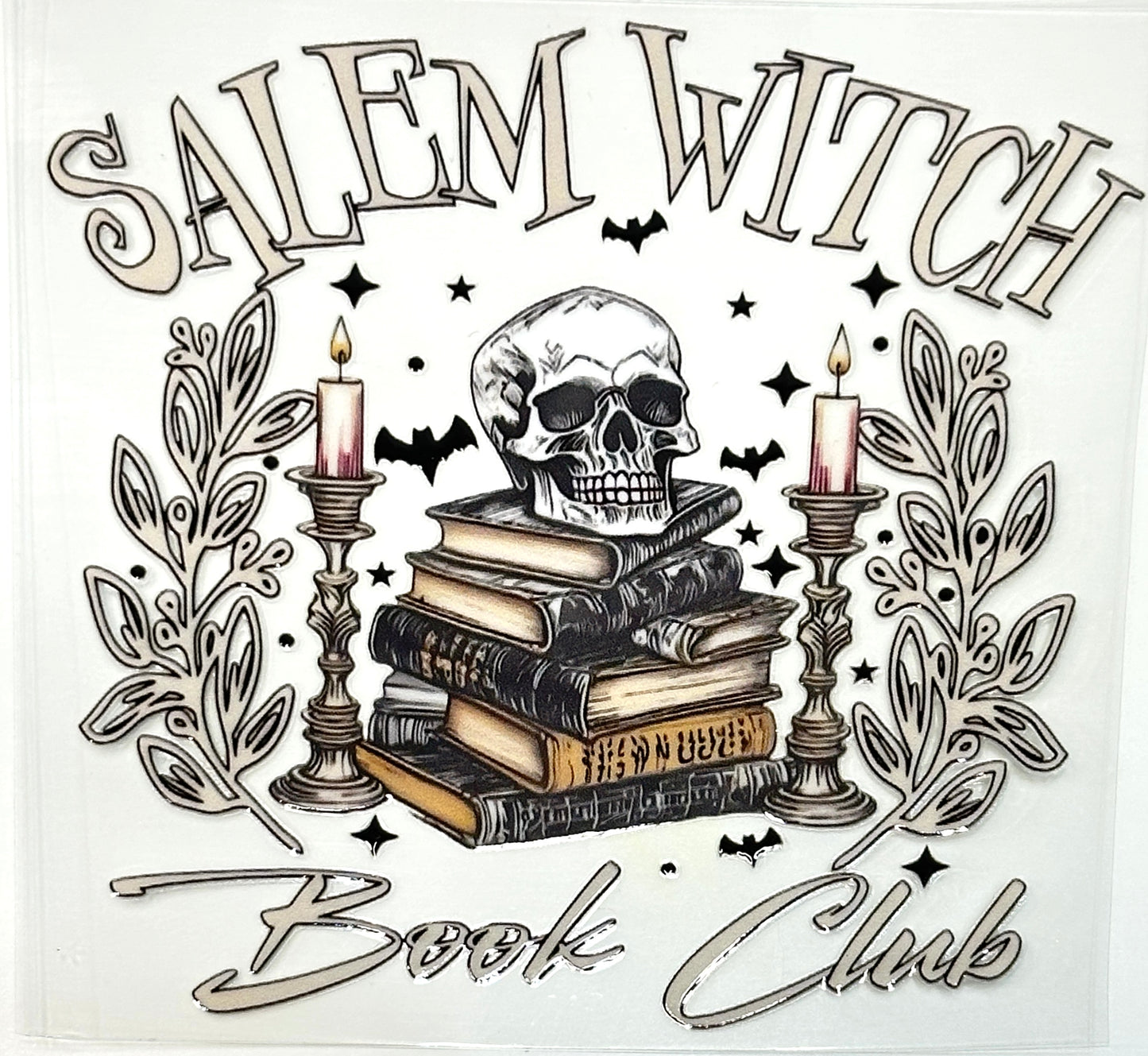 Illustration of a skull, books, candles, and decorative elements with 'Salem Witch Book Club' text.