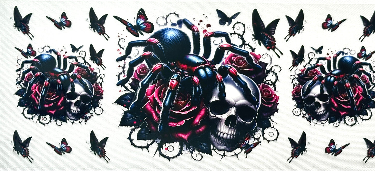 Decorative design with black spider, skulls, roses, and butterflies