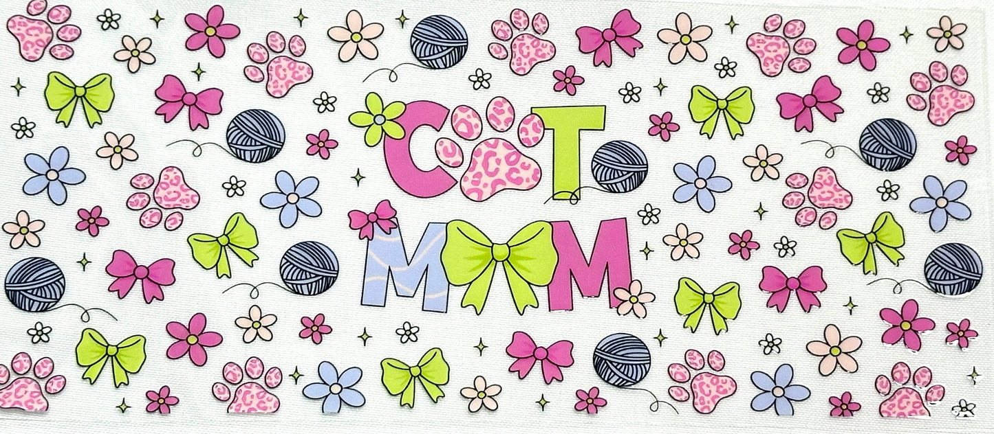 Colorful pattern with 'Cat Mom' text surrounded by flowers, bows, and paw prints.