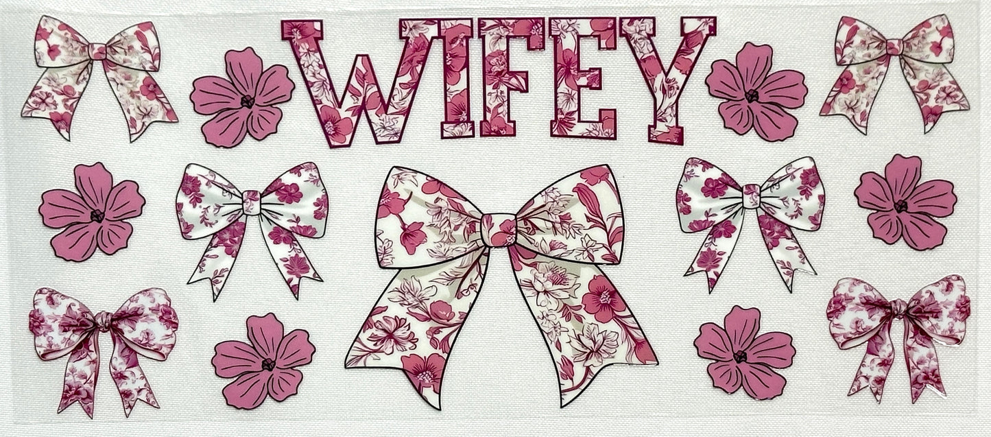Decorative design with floral bows and the word 'WIFEY'