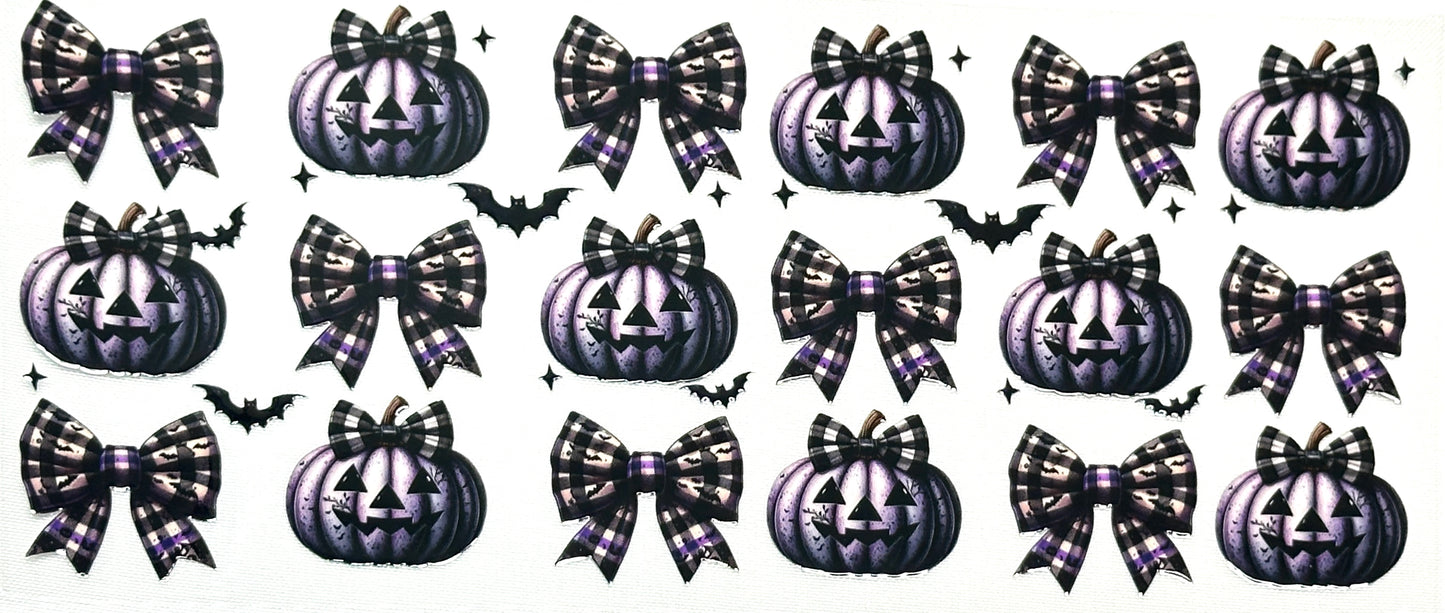 Halloween-themed decorative elements including pumpkins, bows, and bats
