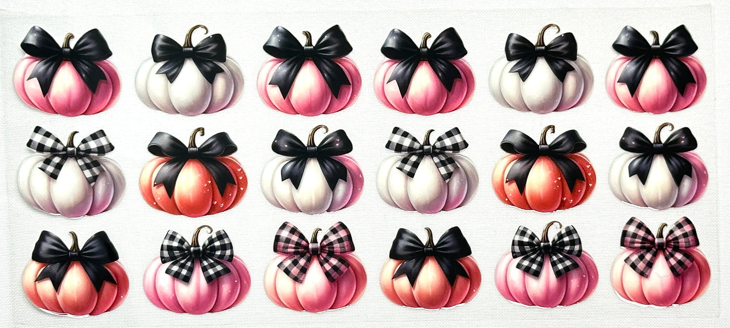 Set of decorative pumpkins with bows in various colors