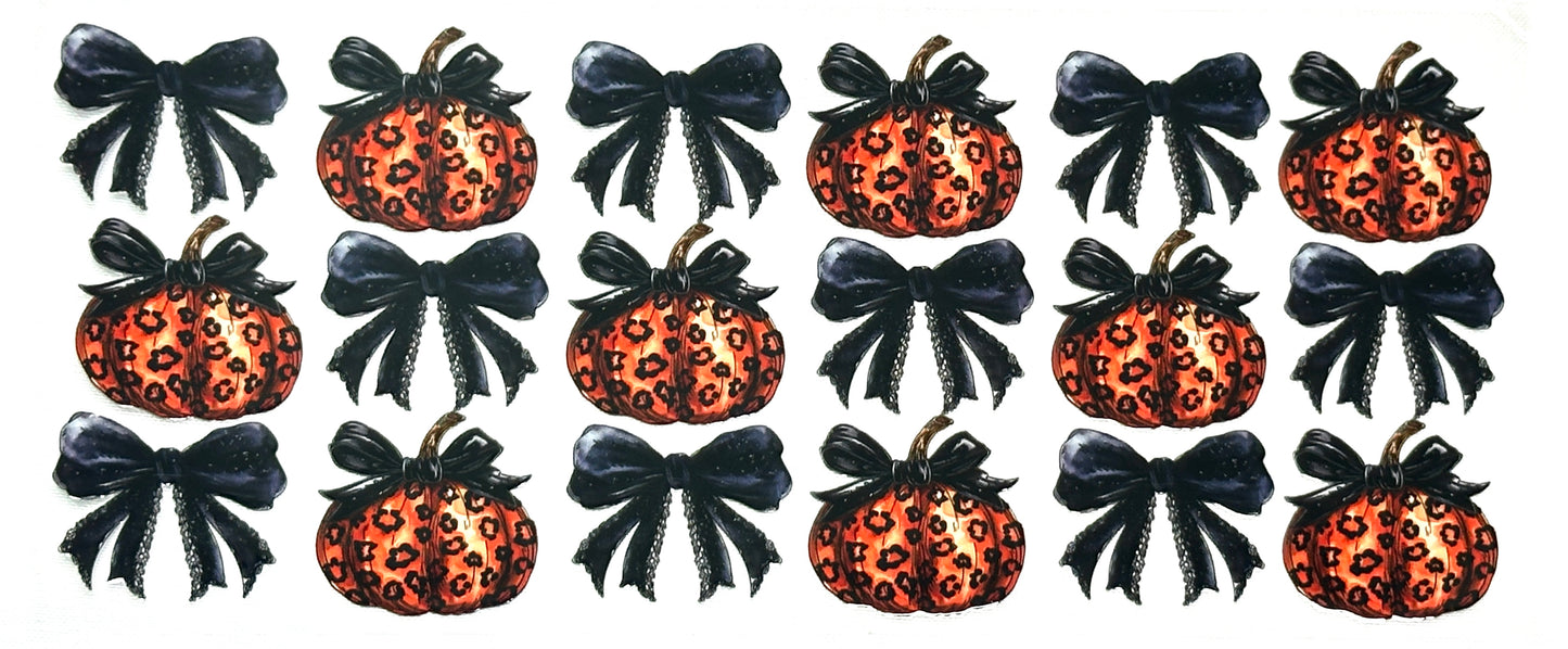 Set of Halloween-themed decorations with pumpkins, bows, and leopard print patterns.
