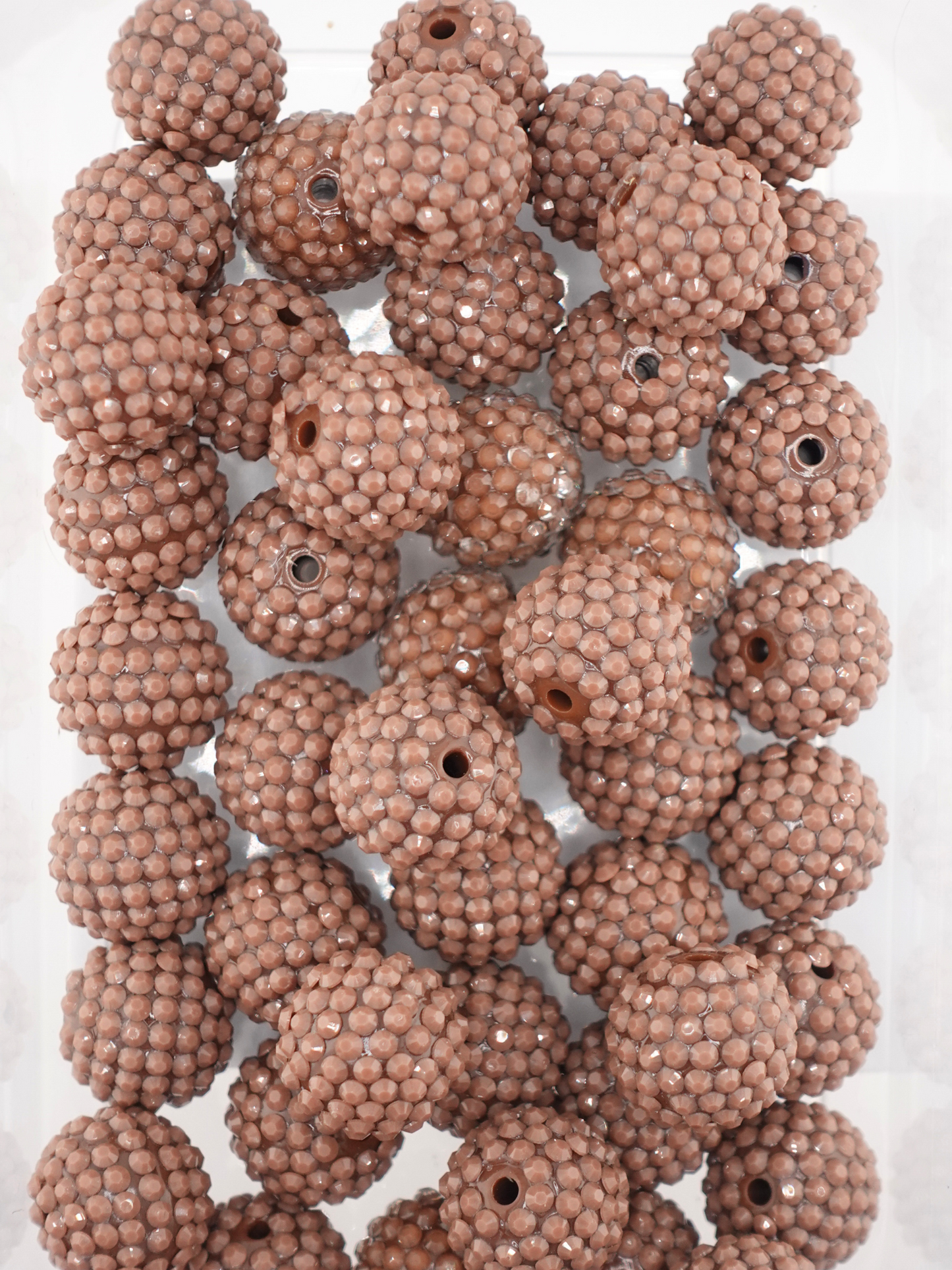 Collection of brown colored jelly rhinestone textured beads