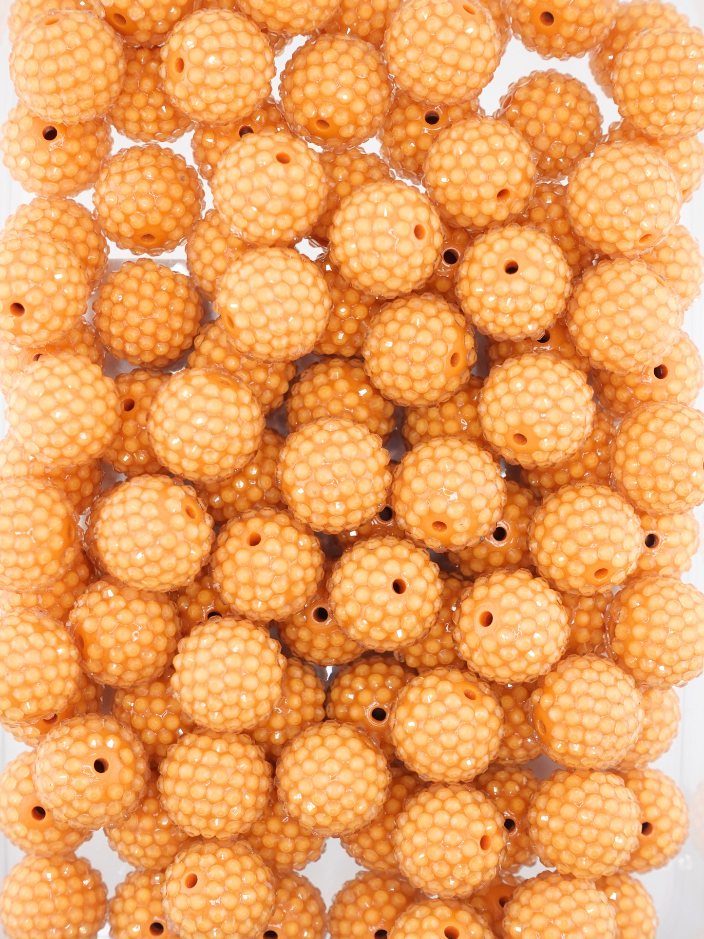 Collection of marigold/dark yellow colored jelly rhinestone textured beads