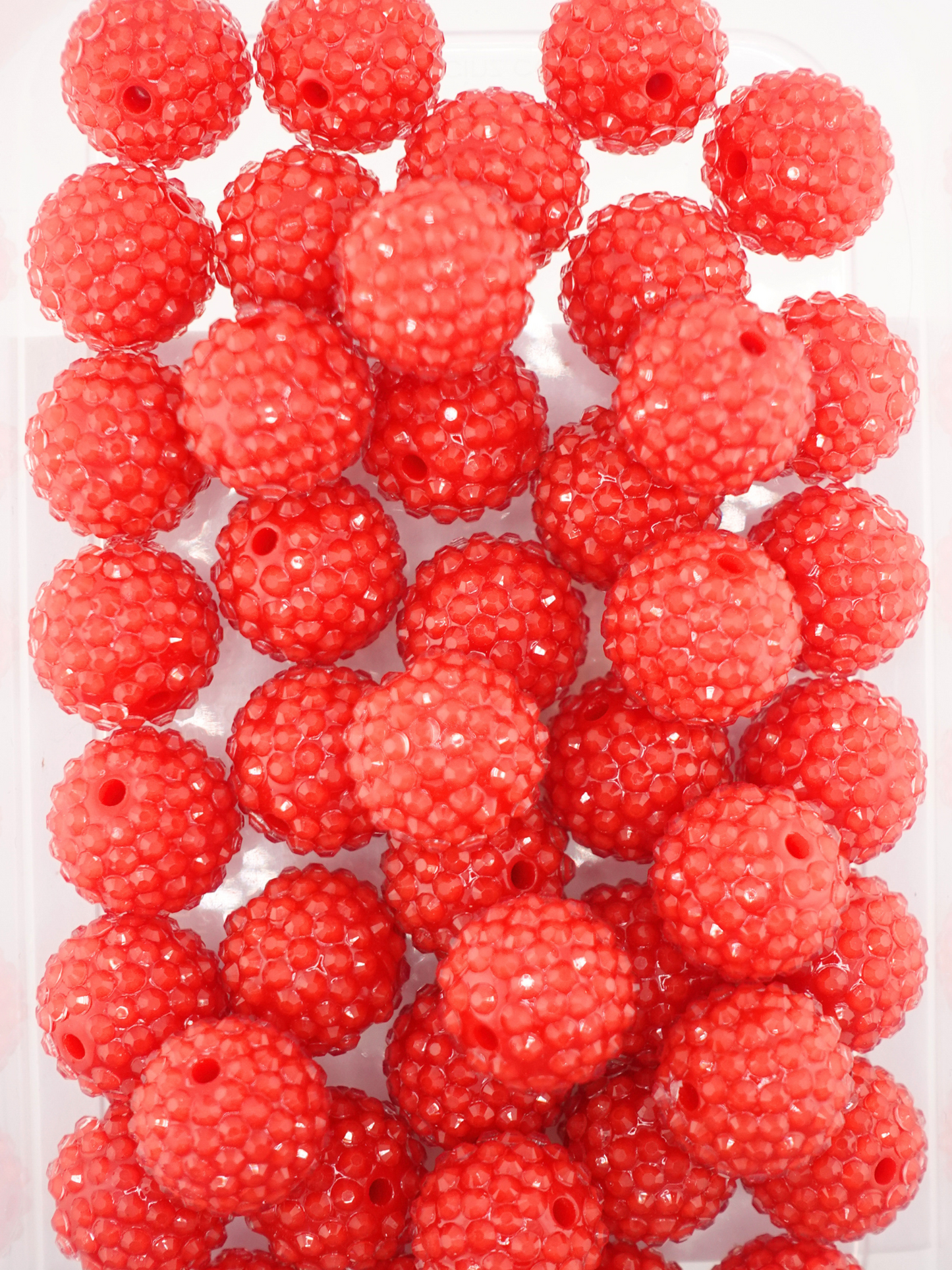 Collection of red colored jelly rhinestone textured beads