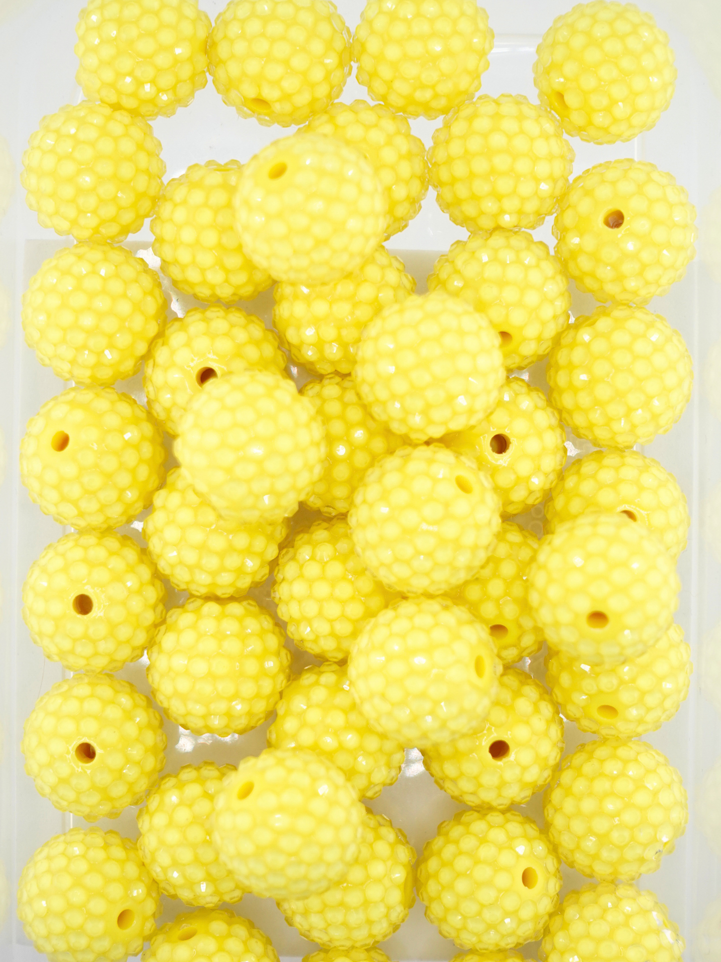 Collection of yellow colored jelly rhinestone textured beads