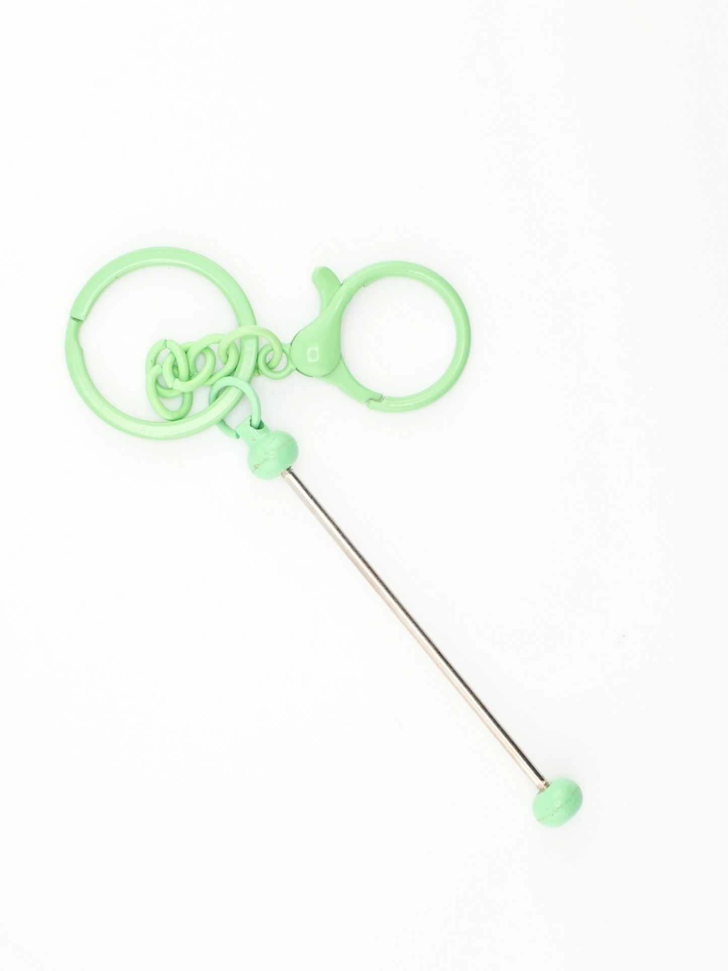 A single light green colored beadable keychain