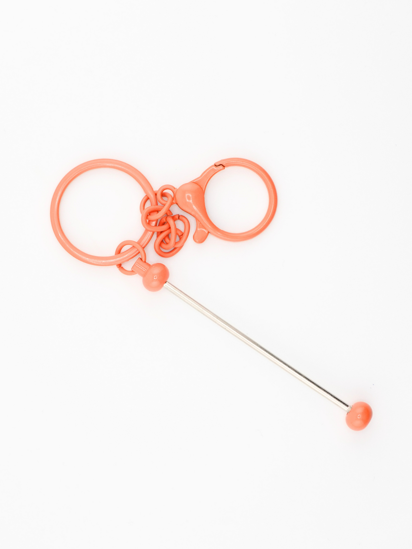 A single orange colored beadable keychain