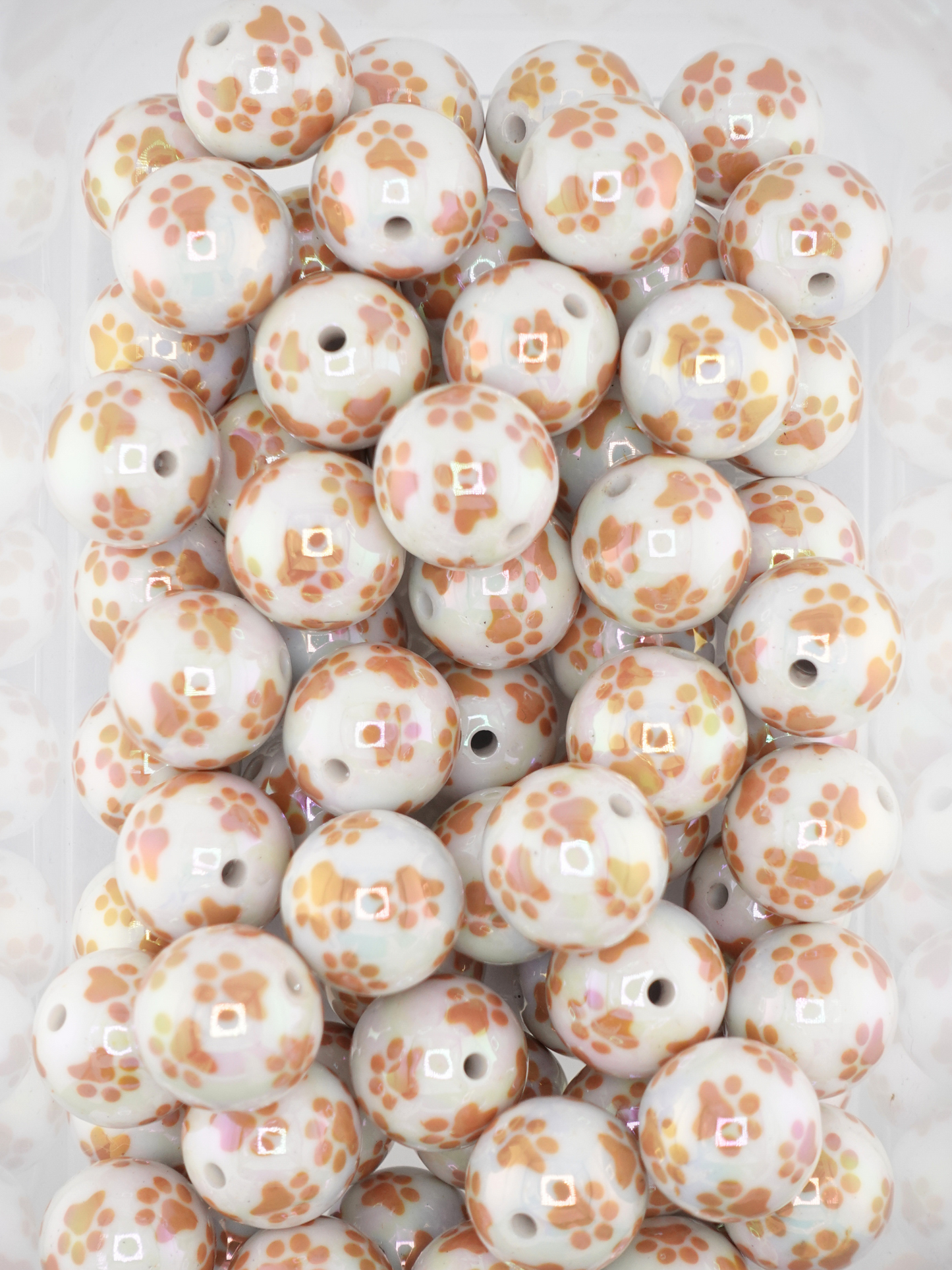 Collection of brown paw prints on white beads