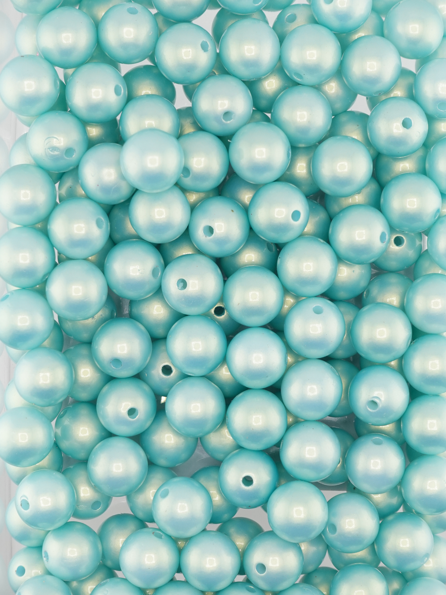Collection of mint colored beads with a pearl shimmer finish