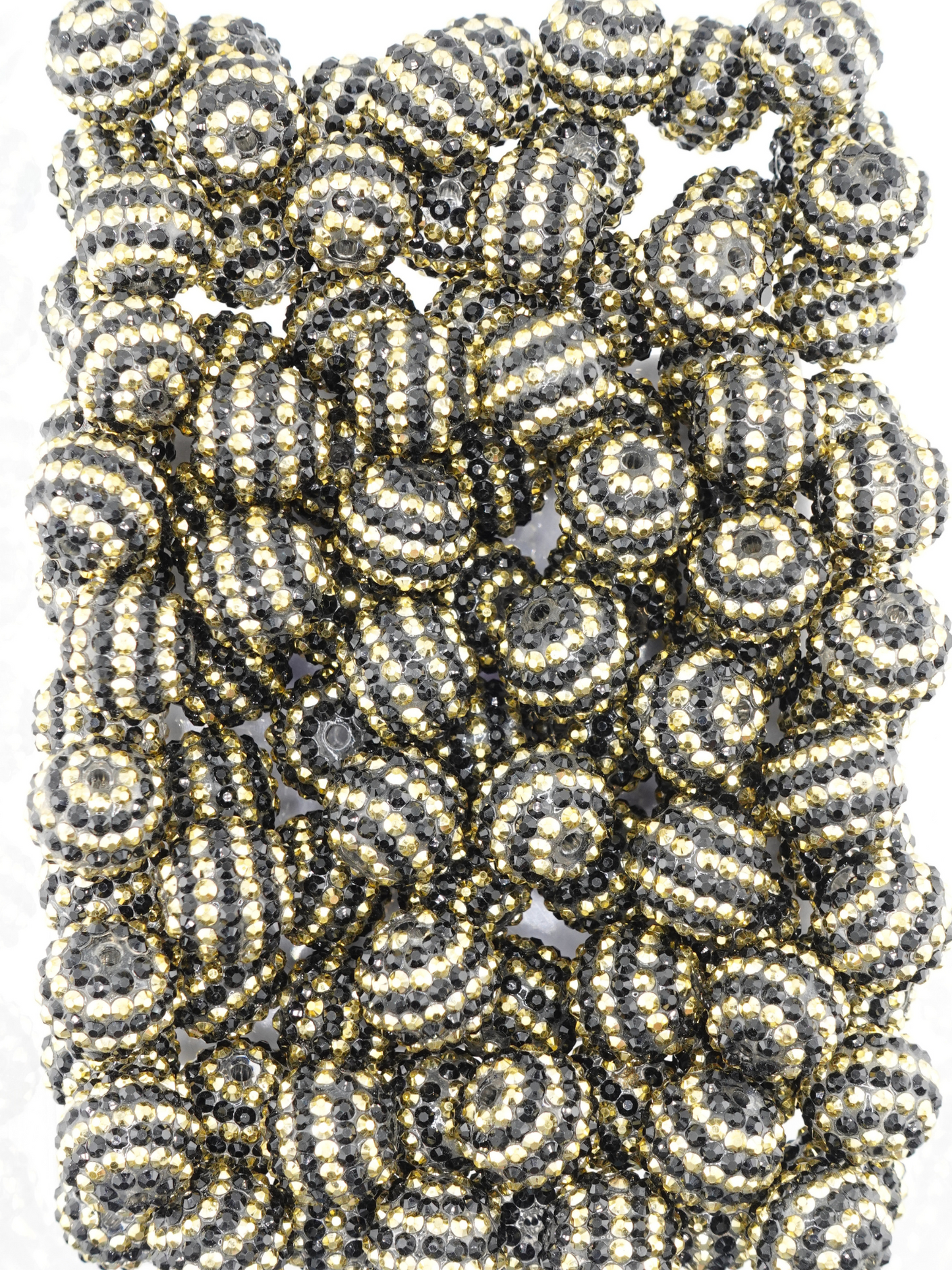 Collection of black and gold beads with a stripe design