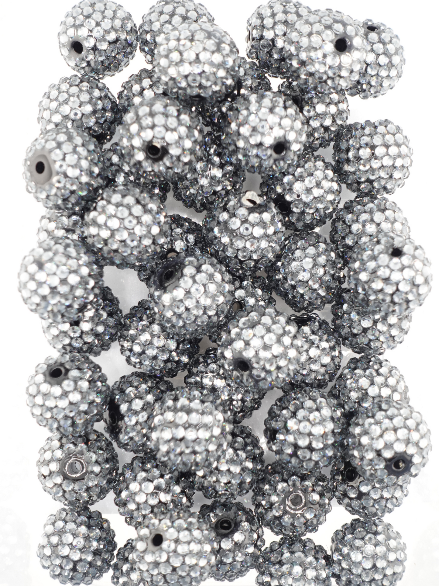 Collection of charcoal colored beads with rhinestone texture