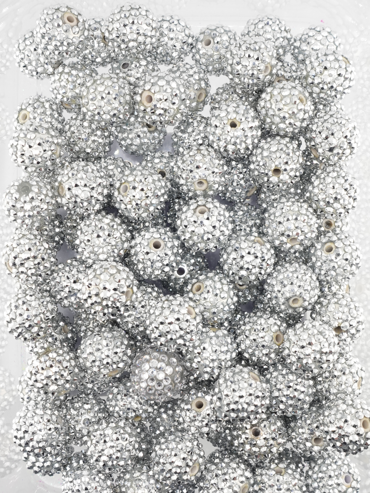 Collection of silver rhinestone textured beads