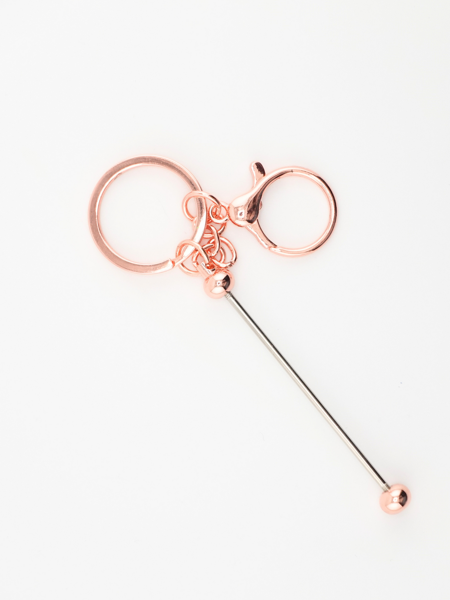 A single rose gold colored beadable keychain