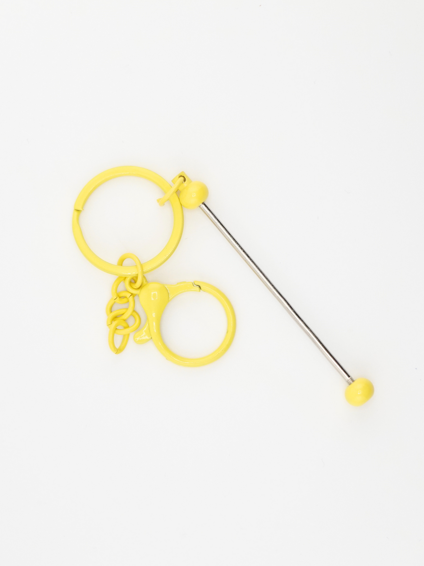 A single yellow colored beadable keychain