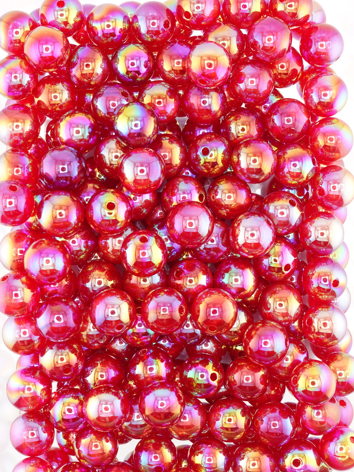 Collection of burgundy colored beads with an aurora borealis and galaxy shimmer