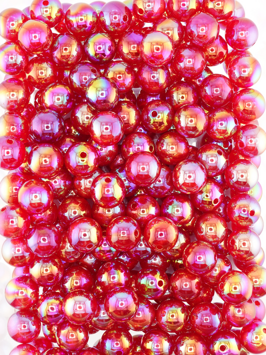 Collection of burgundy colored beads with an aurora borealis and galaxy shimmer