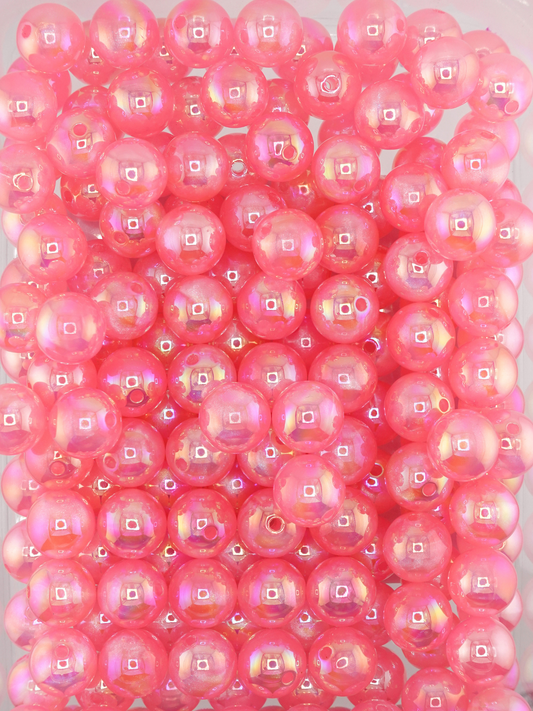 Collection of dark pink colored beads with an aurora borealis and galaxy shimmer