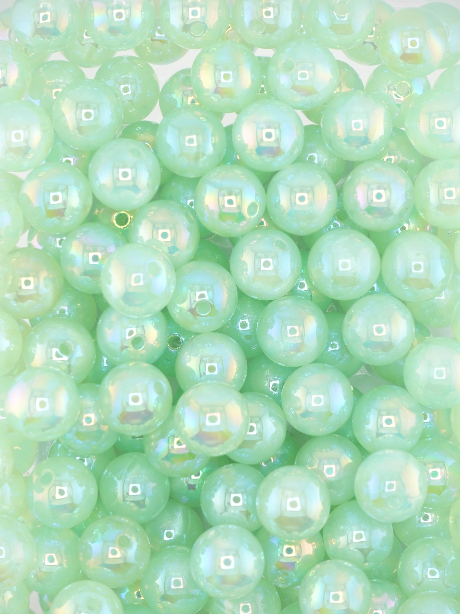 Collection of mint colored beads with an aurora borealis shimmer