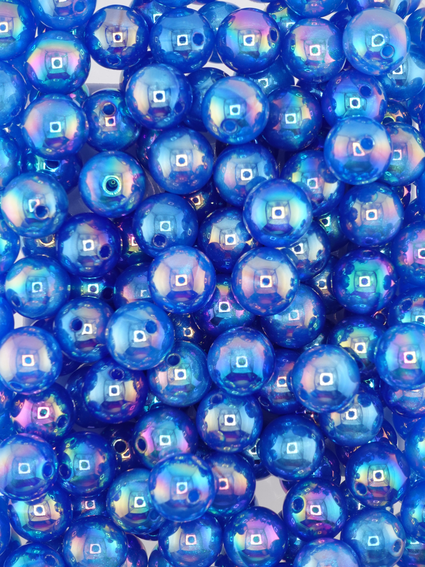 Collection of royal blue colored beads with an aurora borealis shimmer