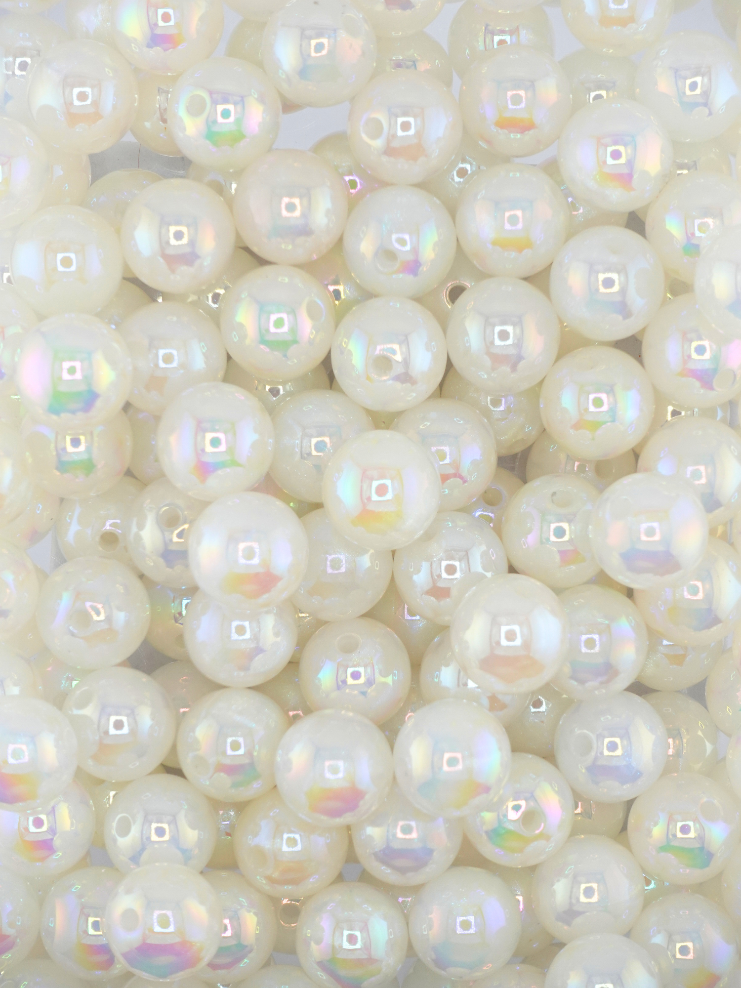 Collection of white colored beads with an aurora borealis shimmer