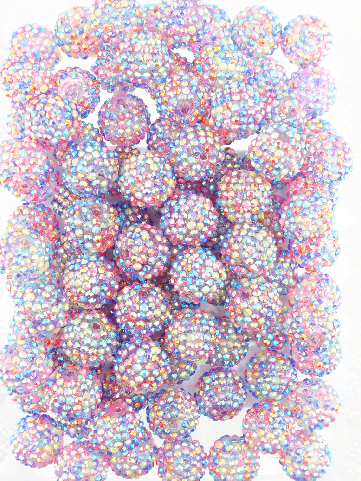 Collection of multicolored beads with shiny aurora borealis finish and rhinestone texture